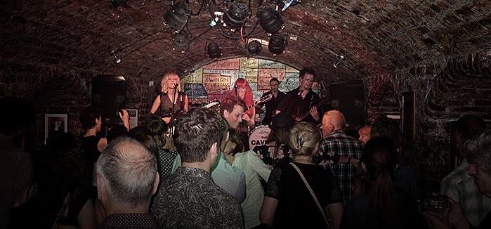 MonaLisa Twins at Cavern Club, Liverpool, band on stage with audience in front
