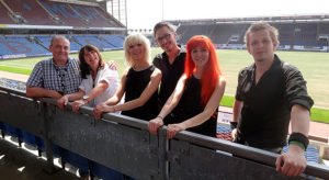 MonaLisa Twins at Burnley Football Stadium, Lancashire, playing their original "The Wide, Wide Land" for Dementia Awareness Week 2014, aired on Sally Naden Show, BBC Radio Lancashire