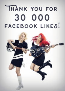 30 000 Facebook Likes - Mona and Lisa in black and white 60s Mods' dresses and boots, with their Rickenbacker and Gretsch guitars jumping with joy.