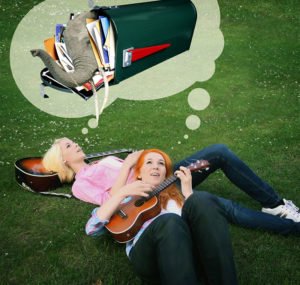 MonaLisa Twins lying in grass to announce New Fan Mail Address