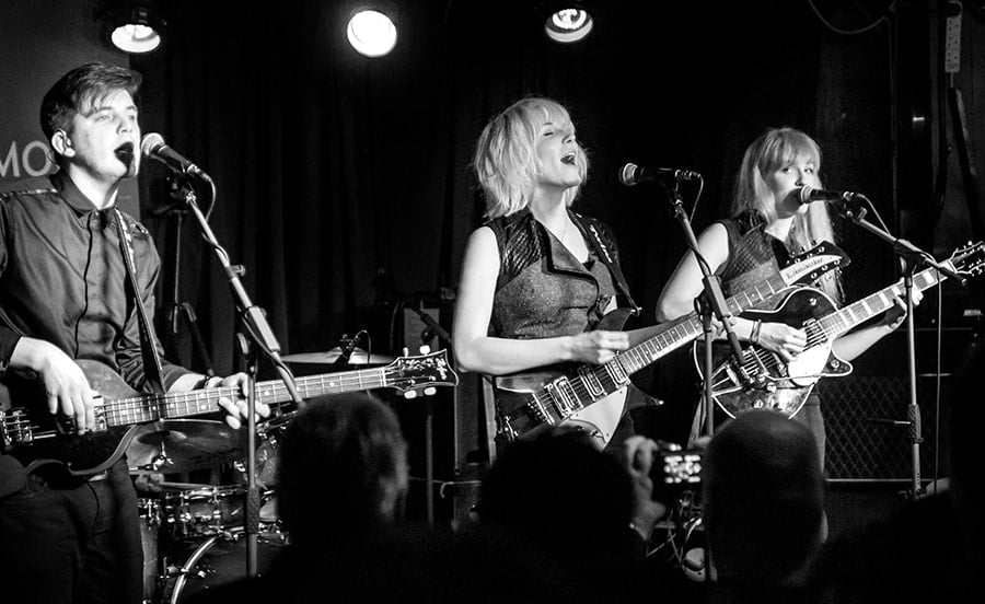 MonaLisa Twins playing a showcase concert at the Half Moon, Putney, London - black and white photo on stage