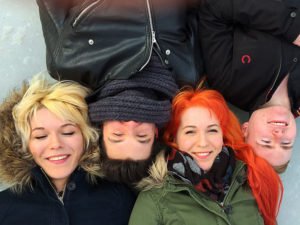 Aerial view of MonaLisa Twins and band, on the frozen lake in Tampere city park, shot with a drone.