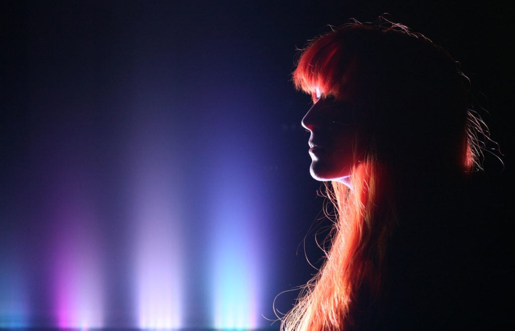 Backlight profile portrait of Lisa during the video shoot for "Nothing Is In Vain"