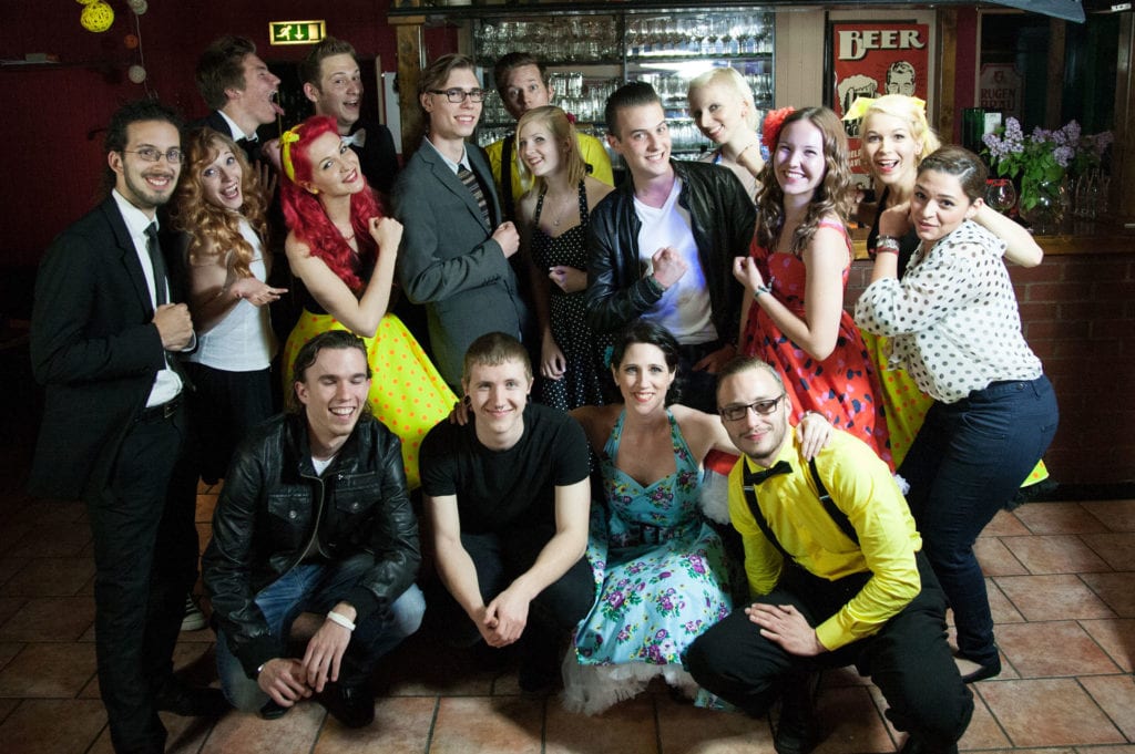 Group photo of the 50s styled cast of the "One More Time" video shoot